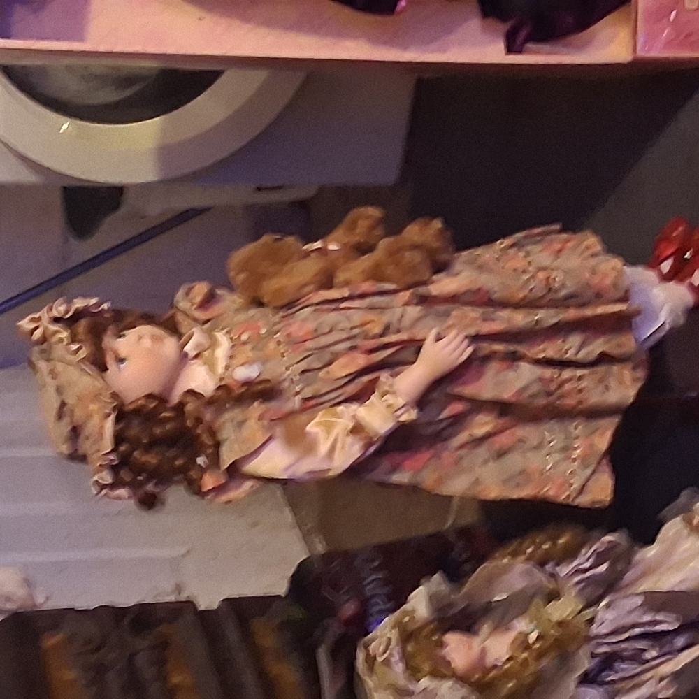 Elegant Doll with Floral Dress and Curly Hair